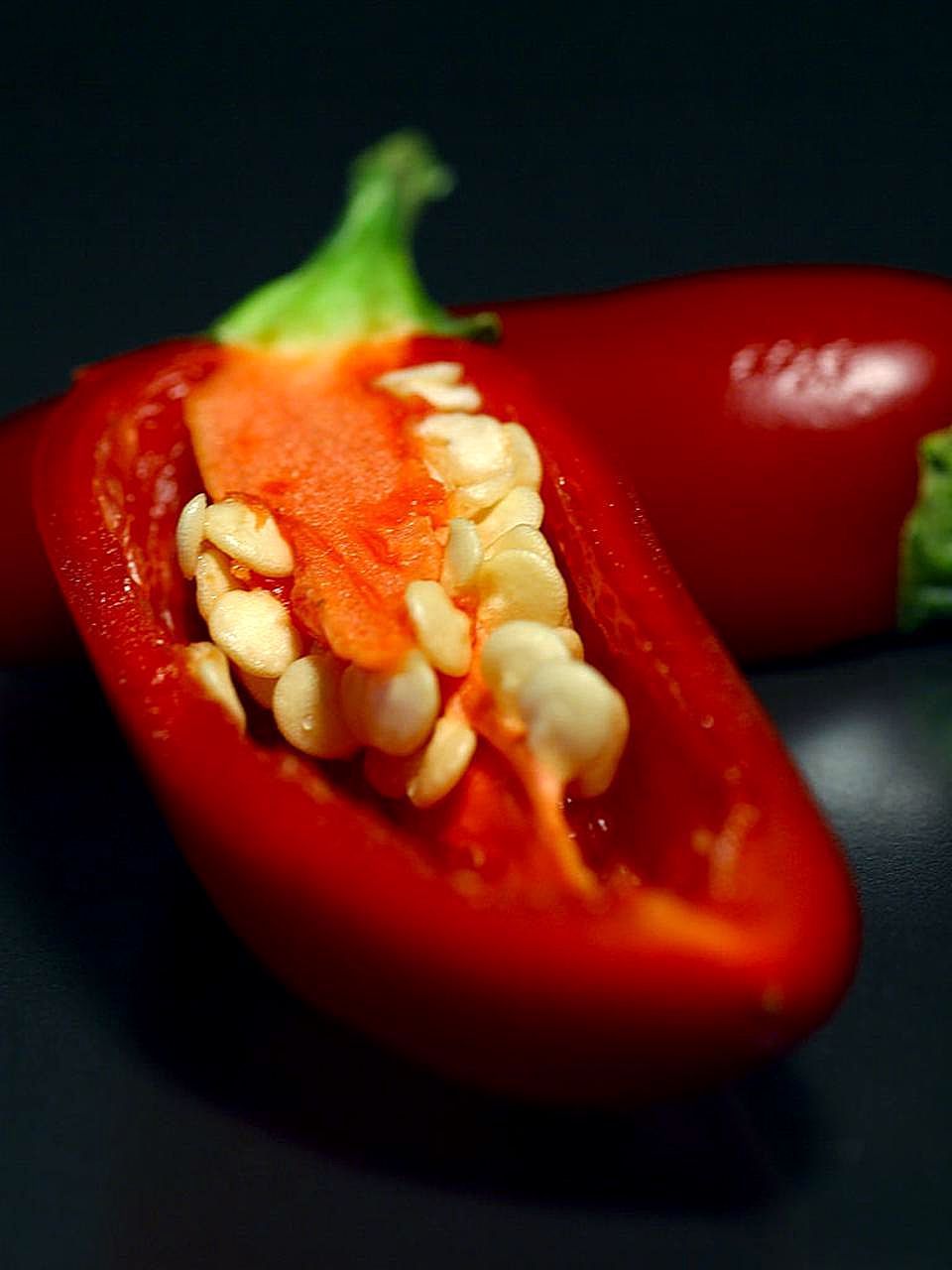The spicy oils are largely contained in the seeds and the veins of the jalapeño pepper. Wear gloves and avoid pepper fingers when de-seeding and de-veining your peppers. Photo by Jon Sullivan 