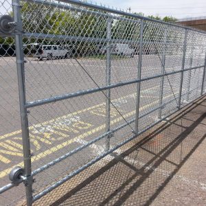 Rolling fence providing security and style for Denver businesses - custom rolling gates Denver