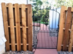 Metal Gate with Shadow Wood Fence
