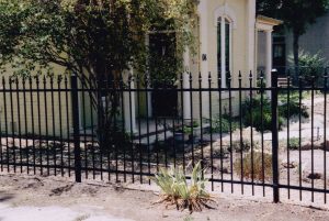 Denver home featuring a stylish ornamental fence, a trend in modern design - 2-rail ornamental steel fence