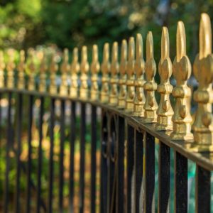 Golden-topped railings outside a house in Bournemouth.